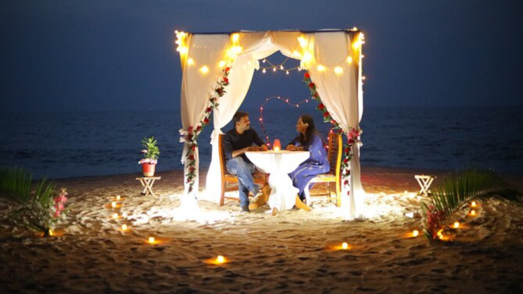 Candle Night Dinner In Andaman, couple sitting near by sea shore.